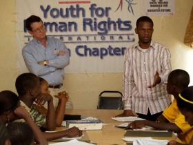 Tim Bowles and Jay Yarsiah delivering a human rights lecture in Liberia.